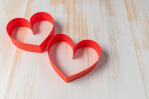 Two hearts made of ribbon on wooden background. Valentines day. - Φωτογραφία, εικόνα
