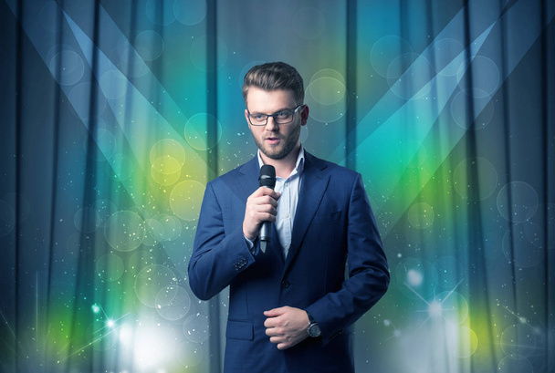 Businessman holding microphone - Fotó, kép