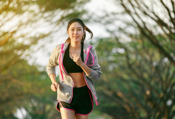 fitness woman running in park - 写真・画像