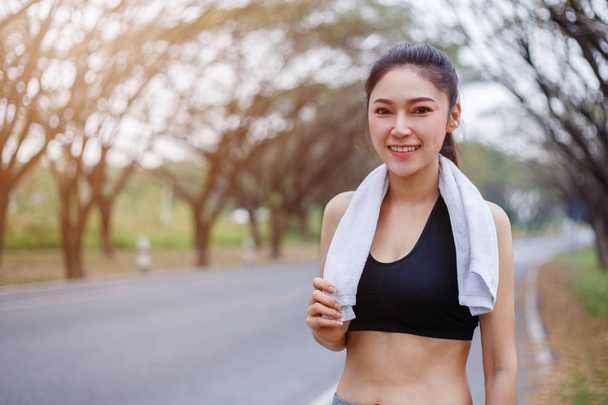 young sporty woman with white towel resting after workout sport  - Photo, image