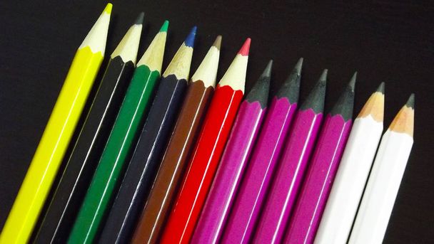 Beautiful pencils on black background. - Foto, Bild