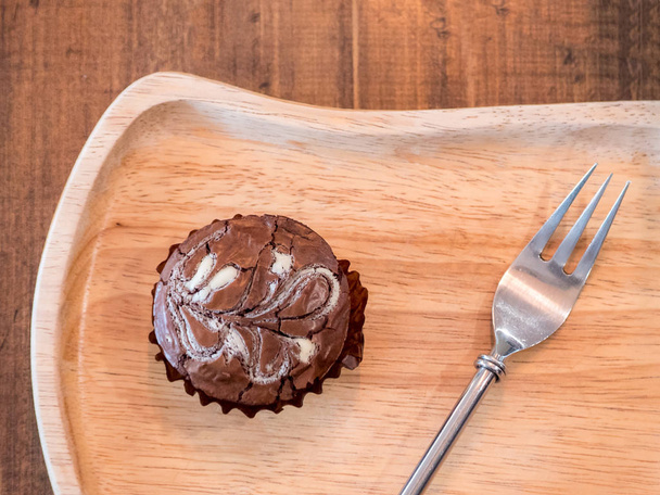 Homemade artisan dark chocolate brownies , on wood dish - Fotó, kép