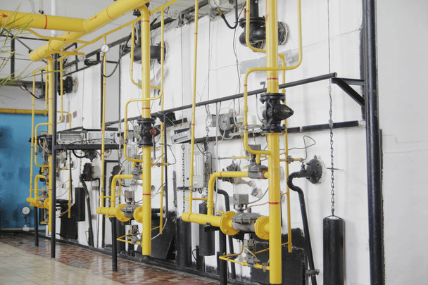 Manufacturing site - yellow tubes and pressure gauges - Photo, Image