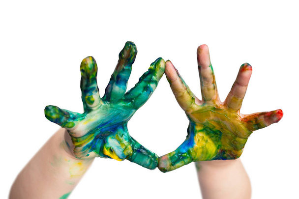 Colorful paint on little children hands - Foto, Imagen
