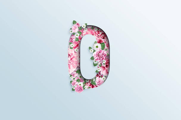 The number zero consists of pink flowers and green leaves on a light background. Spring background. flat lay, copy space, Mixed media, top view. - Valokuva, kuva