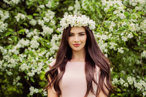 Young smiling woman wearing flowers wreath.  - Photo, Image