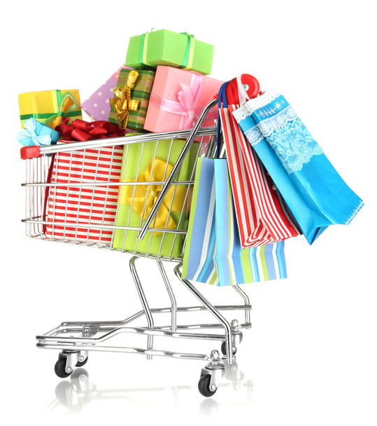 Christmas gifts and shopping in trolley isolated on white - Foto, afbeelding