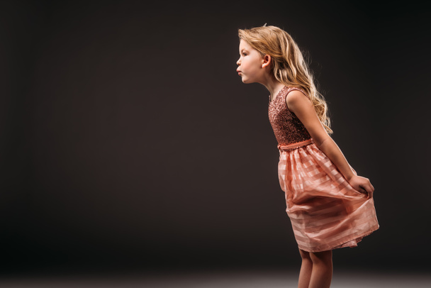 pretty child in pink dress, isolated on grey - Foto, Imagem