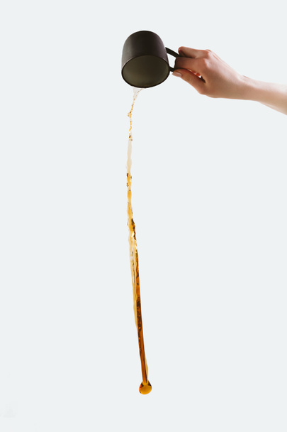 cropped view of hand pouring out coffee, isolated on white - Photo, Image