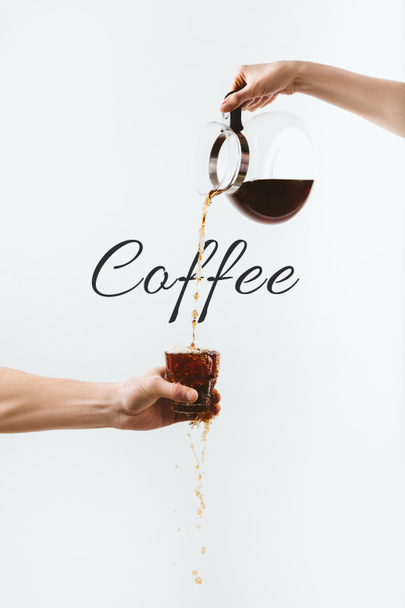 cropped view of hands pouring coffee from pot into glass, isolated on white with "Coffee" lettering - Photo, Image