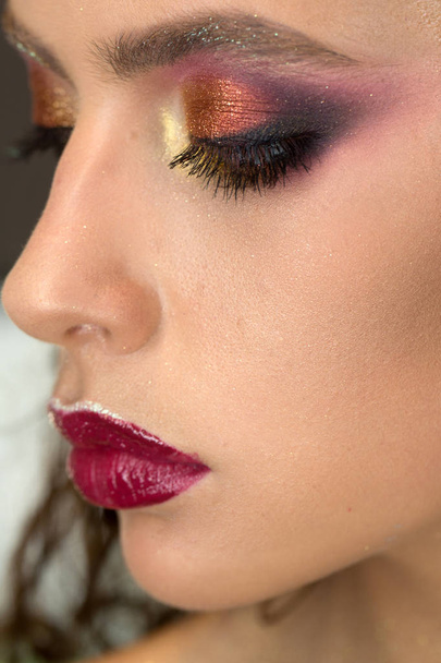 Woman with eye makeup and purple lips, beauty. Woman with young skin face, skincare and youth. Beauty model with glamour look and makeup. Skincare, cosmetics and visage. Fashion girl trend and style. - 写真・画像