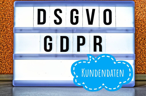 Illuminated board with the inscription DSGVO and GDPR (General Data Protection Regulation) yellow in English GDPR (General Data Protection Regulation) and the inscription Kundendaten in English: customer data - Photo, Image