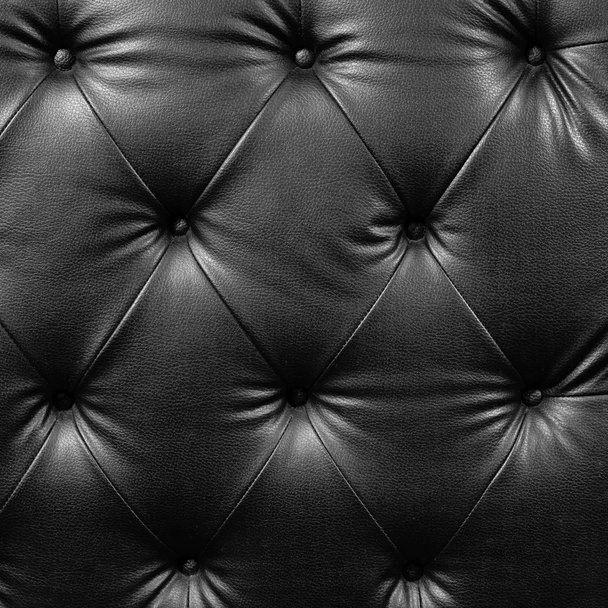 Lähikuva musta ylellisyyttä napitettu nahka
 - Valokuva, kuva