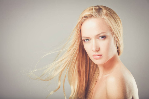 Beauty. Portrait of a young woman on white background - Fotografie, Obrázek