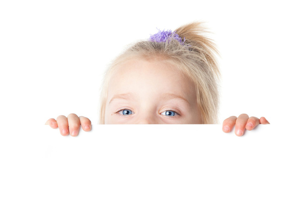 Little girl looking over empty board - Valokuva, kuva