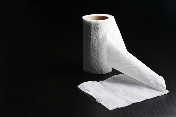 Roll of Tissue paper on black background - Photo, Image