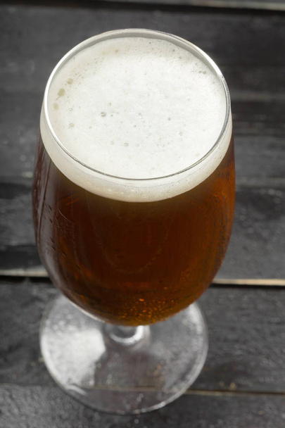 beer glass on a wooden background - Fotoğraf, Görsel