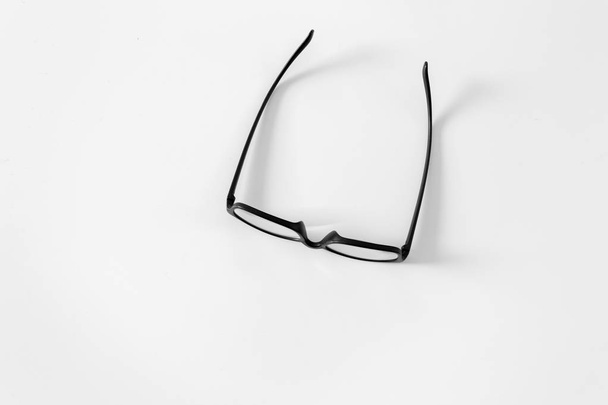 Black glasses on white background - Фото, зображення