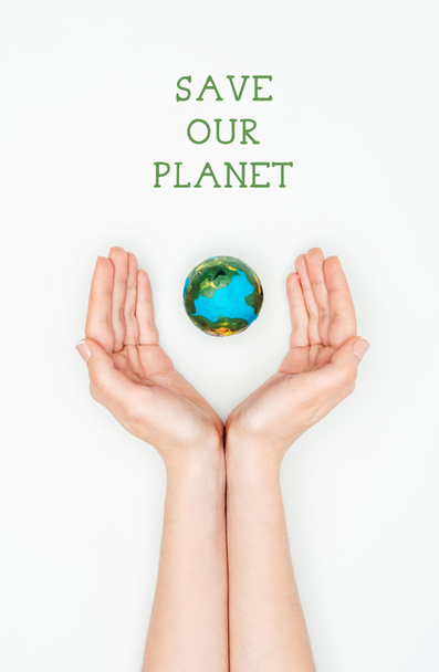 cropped image of woman holding earth model with sign save our planet isolated on white, earth day concept - Φωτογραφία, εικόνα