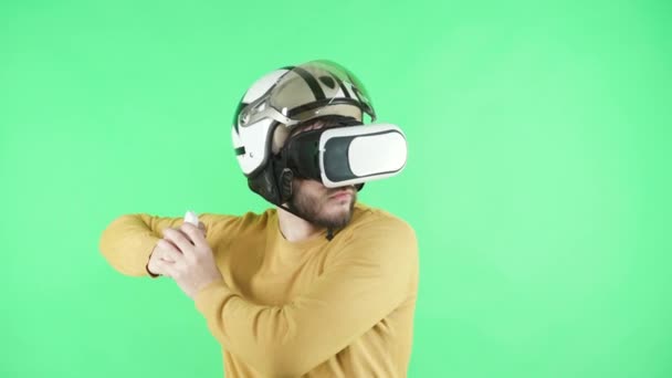 Man playing in virtual reality headset and helmet - Materiaali, video