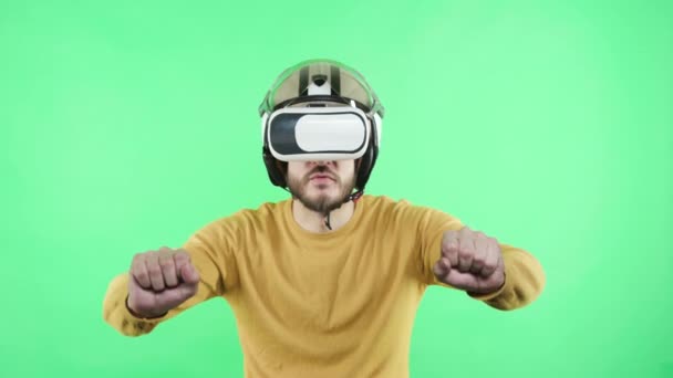 Man playing in virtual reality headset and helmet - Záběry, video
