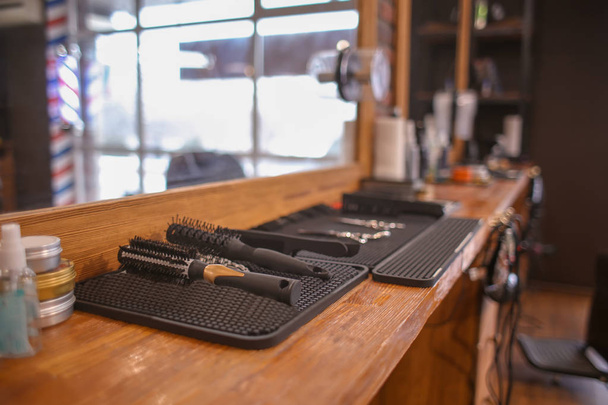 Professional brushes on table in hairdressing salon - Foto, Imagem