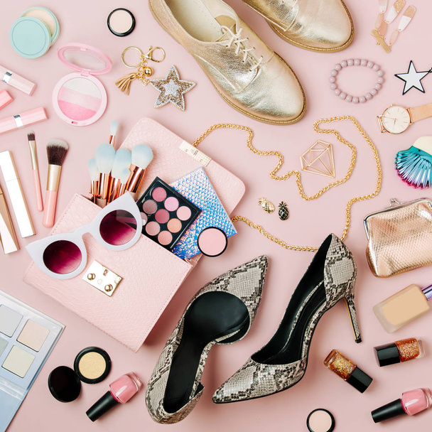 Flat lay of female fashion accessories, makeup products and handbag on pastel color background. - Zdjęcie, obraz