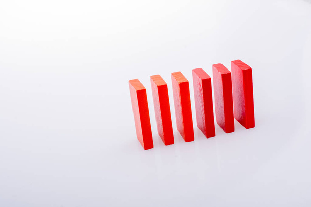 Colorful Domino Blocks in a line on a white background - Fotó, kép