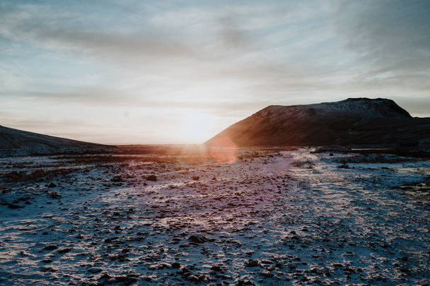 Sunset on a snowy field in Iceland - Фото, изображение