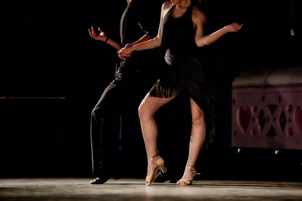 Legs of young dancers on the dance floor  - Fotoğraf, Görsel