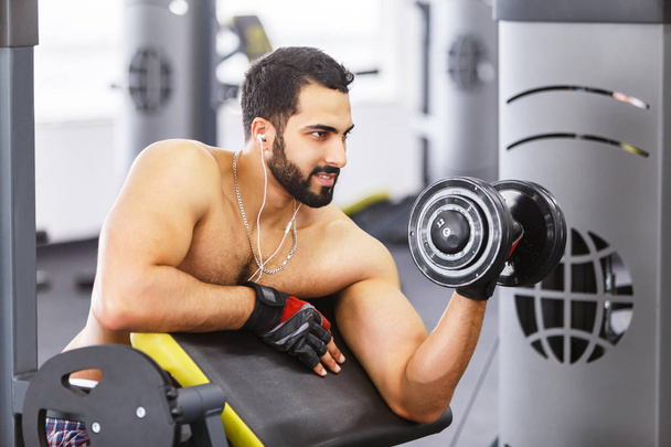 Man Does Dumbbell Workout - 写真・画像