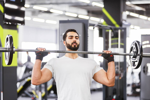 Man with Barbell - Foto, afbeelding