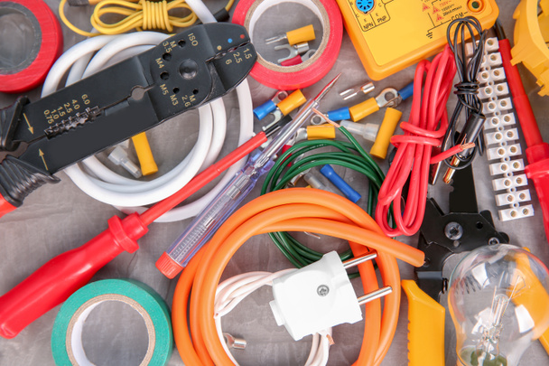 Flat lay composition with electrical tools on grey background - Photo, Image