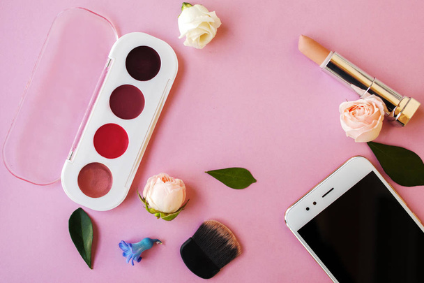 Set cosmetics and Smartphone , women's style, pink background - Фото, изображение