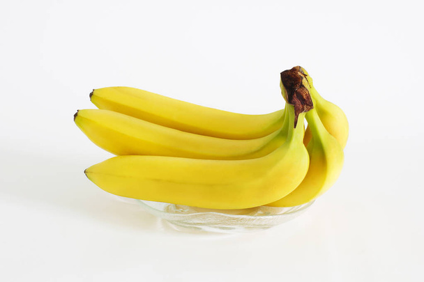 Fruit. Bananas on a white background - Foto, afbeelding