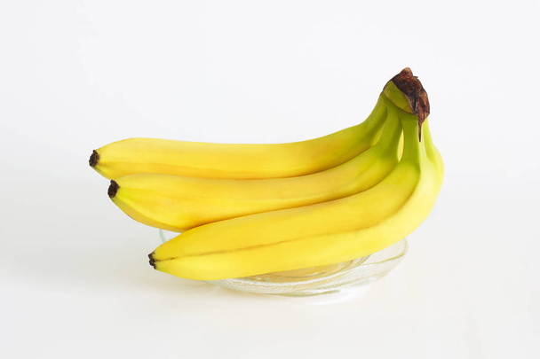 Fruit. Bananas on a white background - Valokuva, kuva