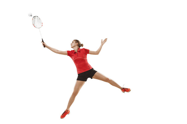 Young woman playing badminton over white background - Foto, Bild