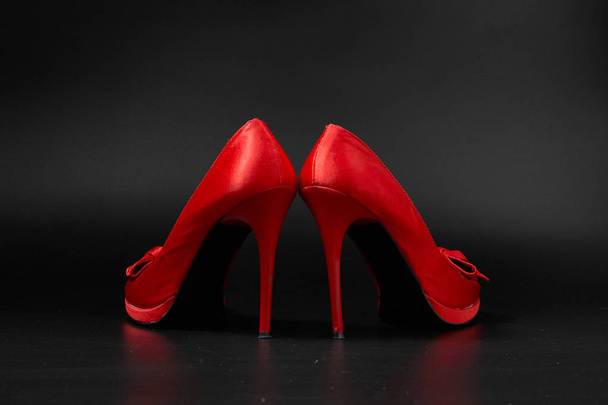 red fashion women shoes on a black background. - Фото, изображение