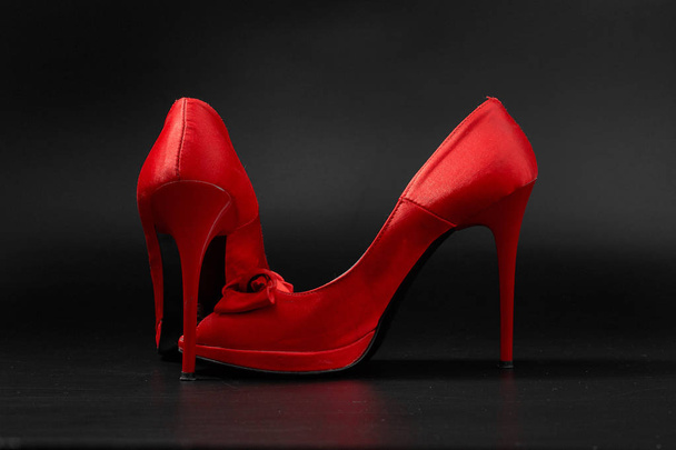 red fashion women shoes on a black background. - Foto, afbeelding