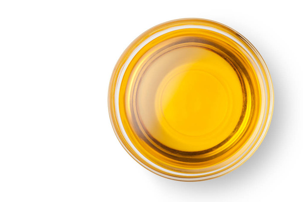 A bowl of peanut oil isolated on white background. Top view. - Фото, зображення