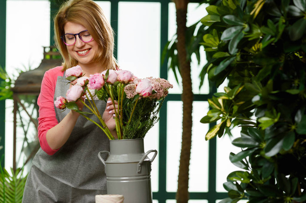 Photo of florist in apron - Photo, image