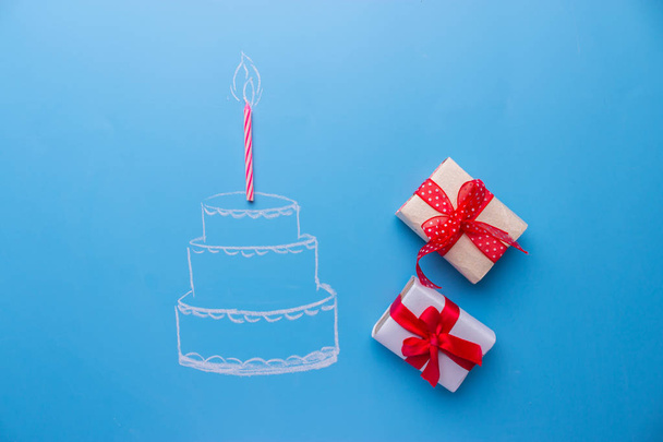 White birthday cake over blue background - Foto, imagen