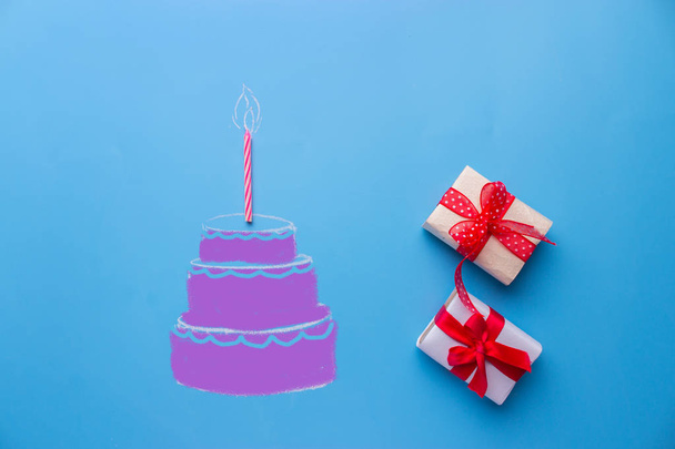 White birthday cake over blue background - Foto, imagen