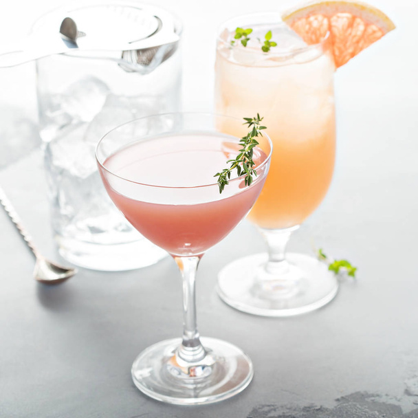 Variety of citrus cocktails on gray surface - Photo, image