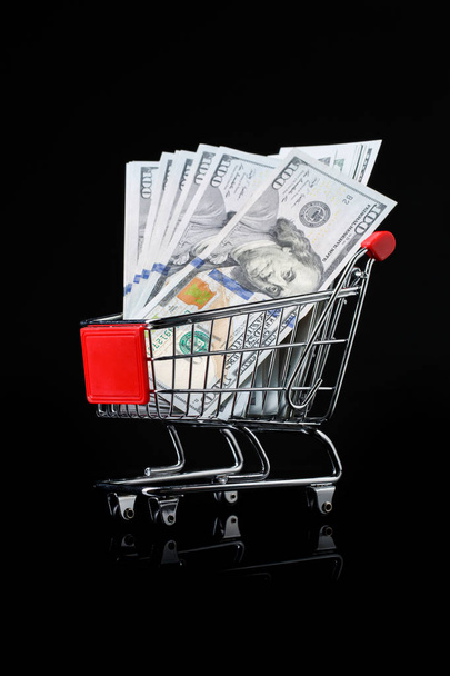 Photo of trolley with dollars - Foto, Imagem