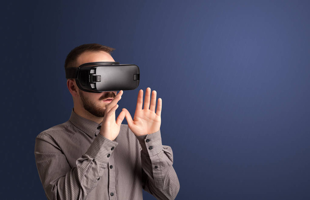 Businessman with virtual reality goggles - Foto, Imagen