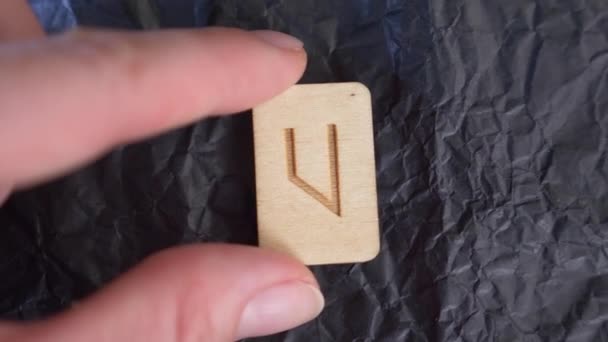 uruz inverted rune. close-up, hand puts the rune on the surface for divination. 4k, slow-motion - Footage, Video