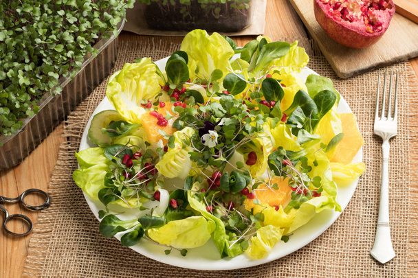 Fruit and vegetable salad with fresh microgreens - Photo, Image