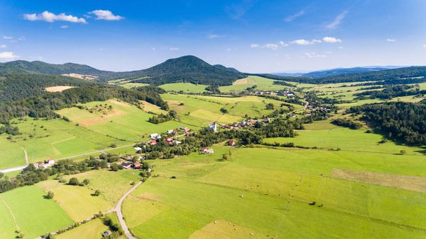 Road, forest, village and field summer landscape from above - drone view - 写真・画像
