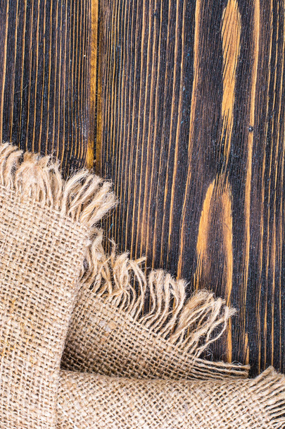 Textura de pano de saco na mesa de madeira
 - Foto, Imagem